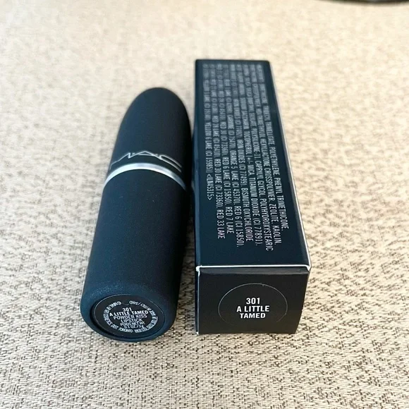 NWT MAC POWDER KISS Lipstick
A LITTLE TAMED - Picture 8 of 8
